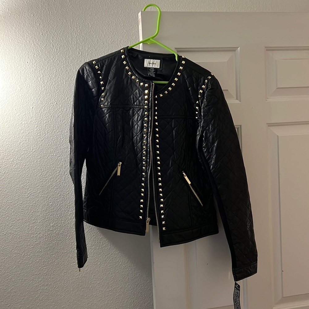 Neiman Marcus exclusive black leather jacket with gold studs.